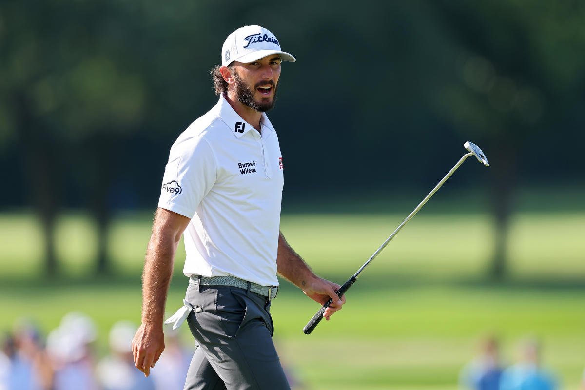 Max Homma is interrupted while throwing a ball by a fan who bet him $3 to miss the BMW Championship